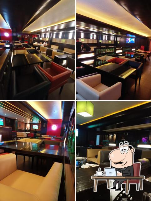 Take a seat at one of the tables at 60ML Sports Lounge & Bar