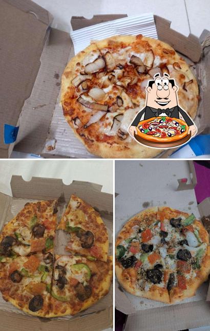 At Domino's Pizza District Center, Kota, you can enjoy pizza