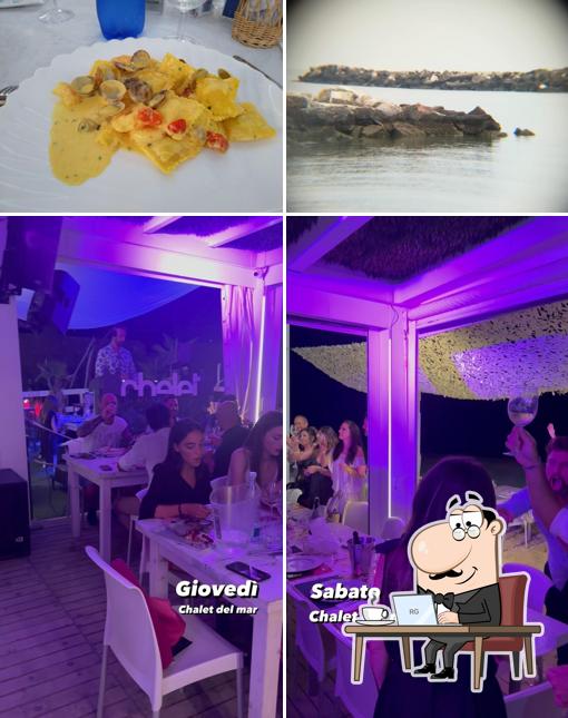 Dai un’occhiata alla foto che mostra la interni e cibo di Chalet del Mare