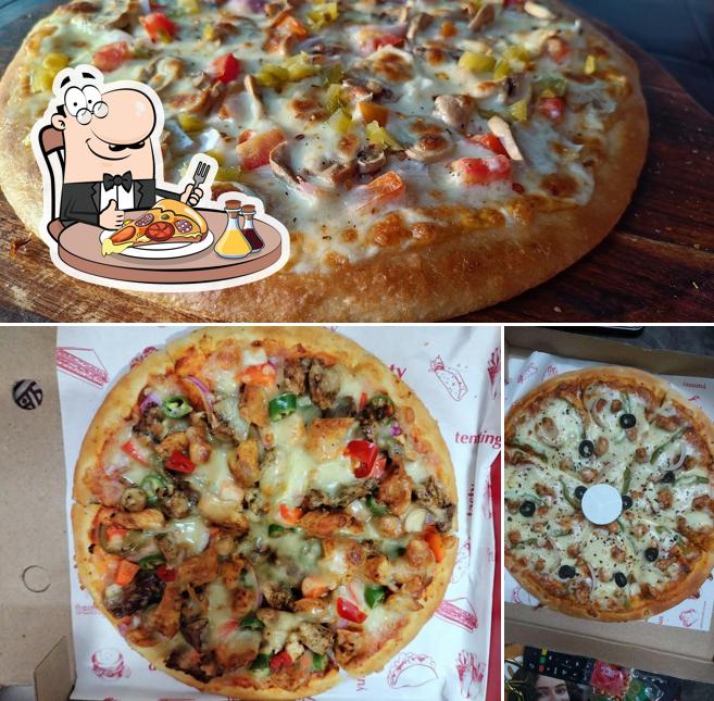 Get pizza at Canadian Fried Chicken