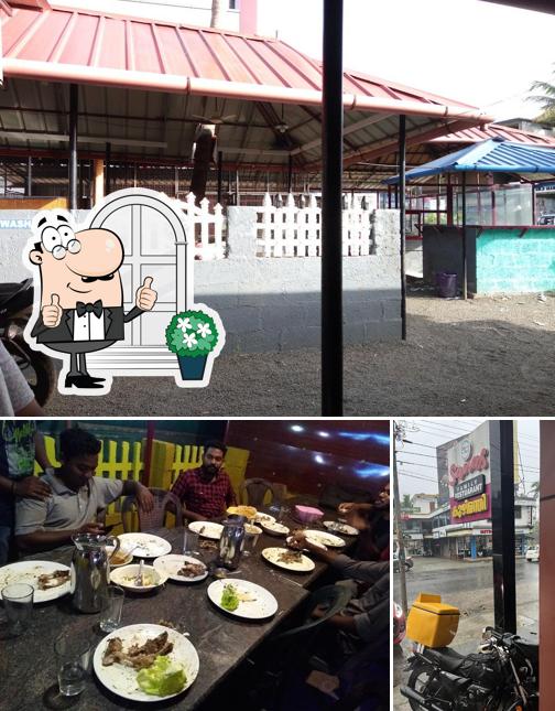 This is the image displaying exterior and dining table at Sanas Food Mahal