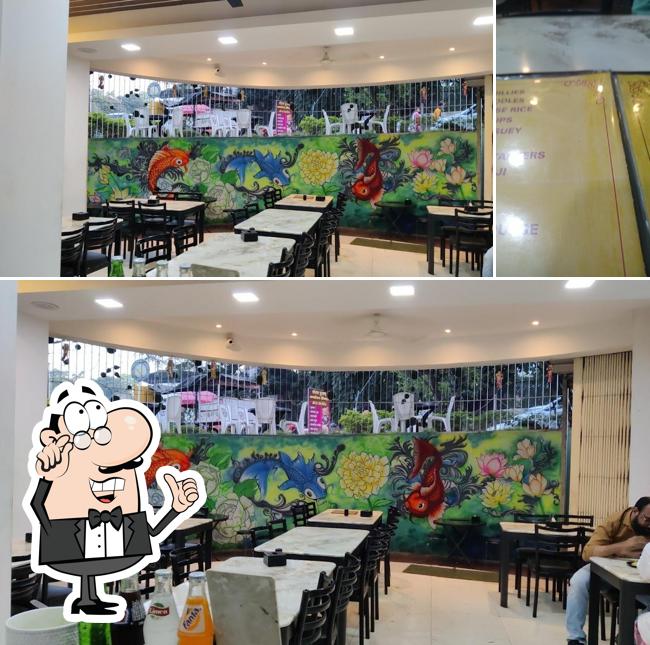Take a seat at one of the tables at Royal foods restaurant