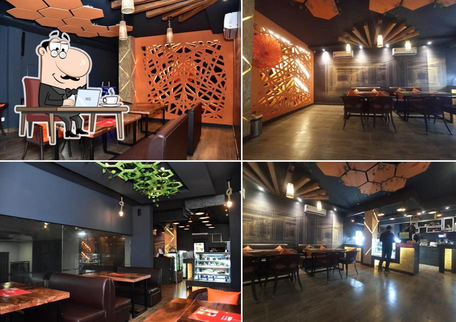 Take a seat at one of the tables at THE CUBE CAFE (JHANKAAR MULTIPLEX)