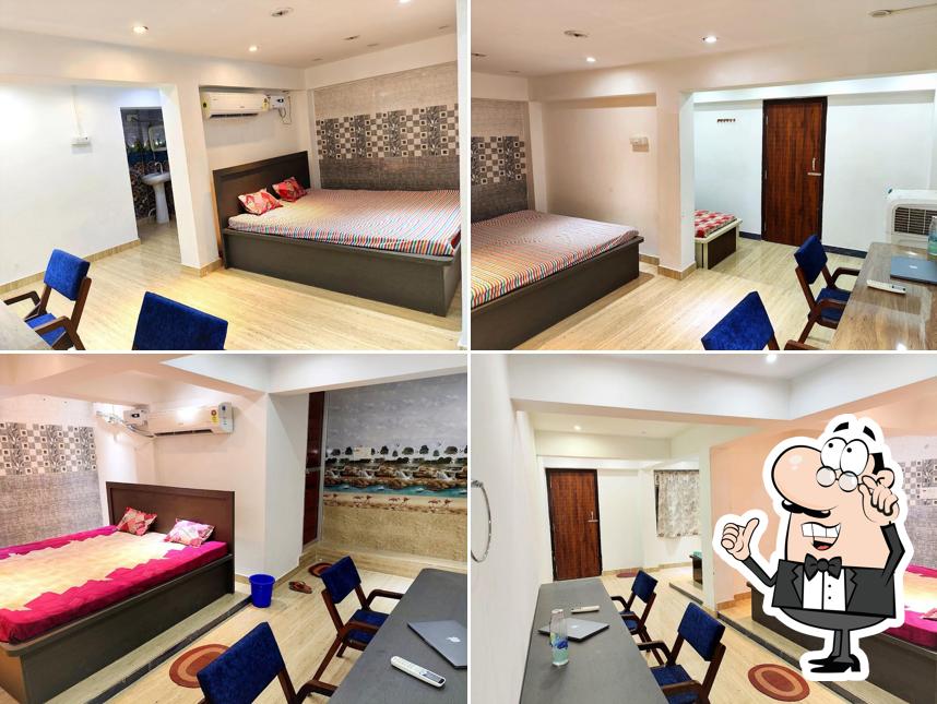 Take a seat at one of the tables at HOTEL SHREE KESHRI NANDAN AND RESTAURANT