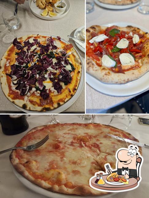 A La Taverna Di Via Pia, puoi goderti una bella pizza