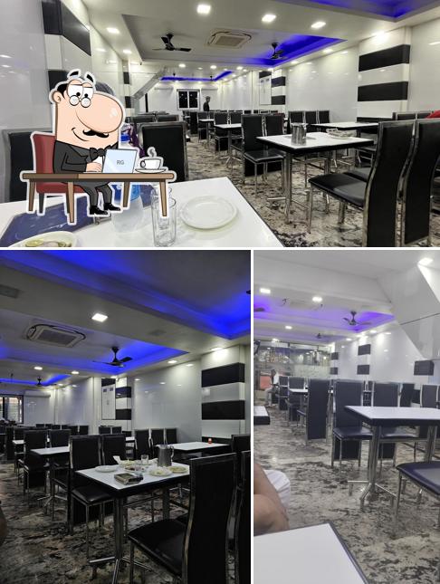 Take a seat at one of the tables at Alamgir Hotel