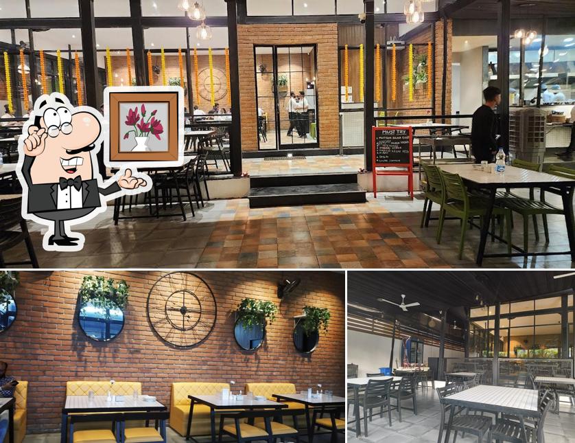 Take a seat at one of the tables at Yalla Yalla