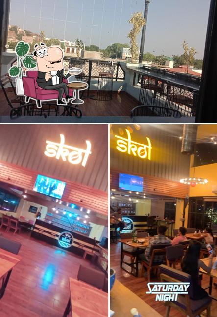 Take a seat at one of the tables at SKOL Rooftop Cafe - Best Cafe in Jodhpur - Best Rooftop Restaurant in Jodhpur