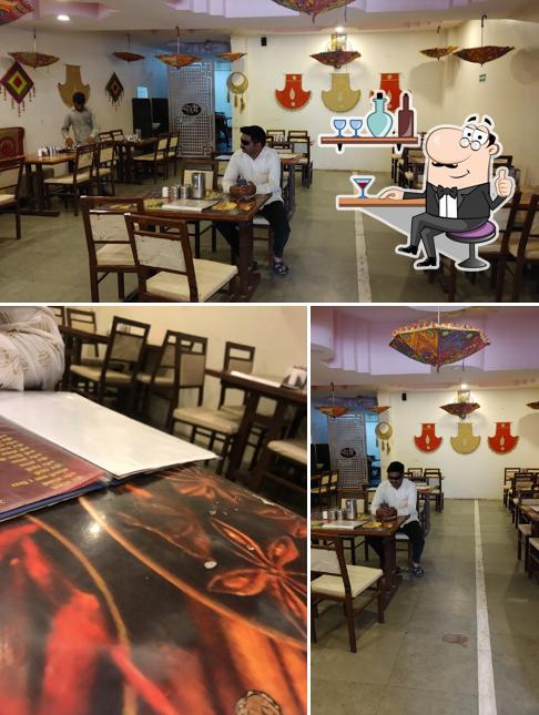 Take a seat at one of the tables at Ruchi Veg