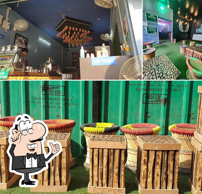 Take a seat at one of the tables at CHAI SUTTA BAR (tapovan)