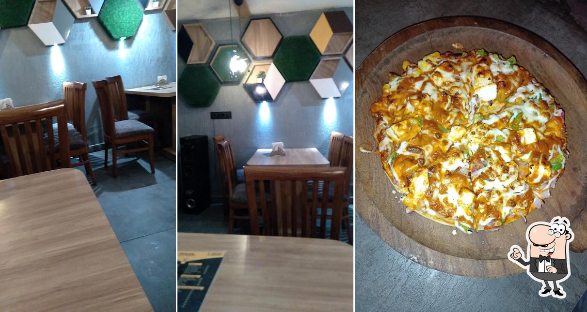 Take a seat at one of the tables at Nukkarh Kitchenette A Family Restaurant