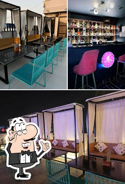 Take a seat at one of the tables at Mamasexy - The Aer Bar