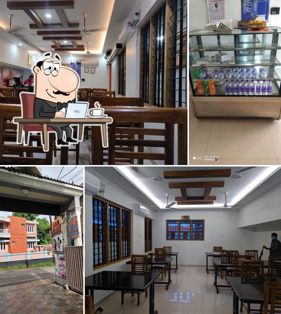 Take a seat at one of the tables at Padma Cafe Kottarakkara