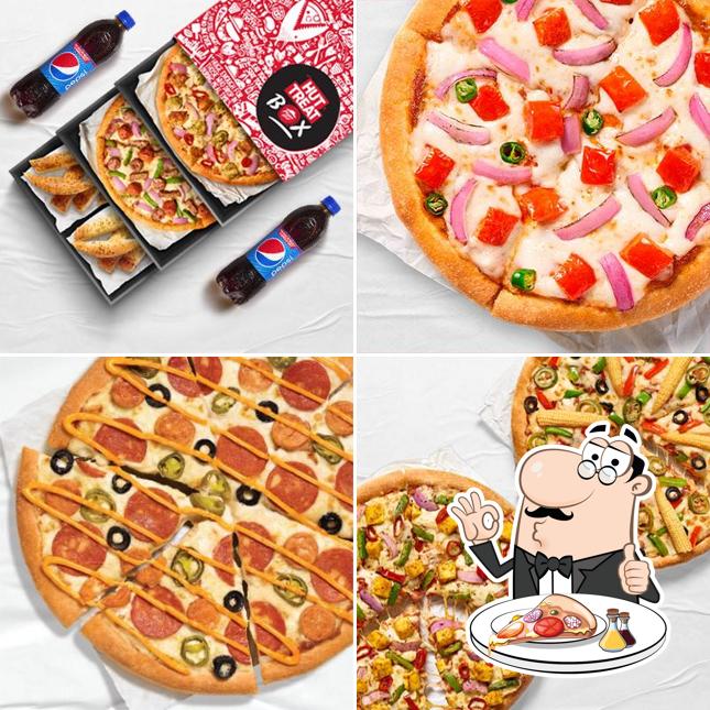 Try out pizza at Pizza Hut Puri Cuttack Road, Bhubaneswar
