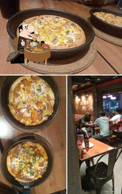 Among various things one can find food and interior at Pizza Hut Poonam Towers, Nagpur