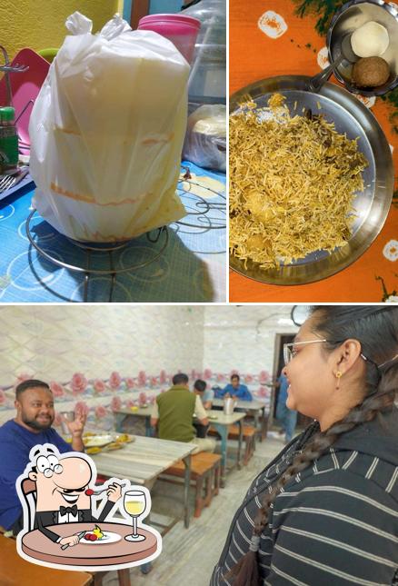 Take a look at the image displaying food and interior at Janata Hindu Hotel and Restaurant