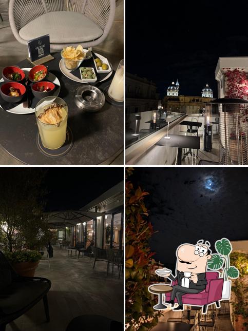 Siediti a un tavolo di Mùn Rooftop Cocktail Bar