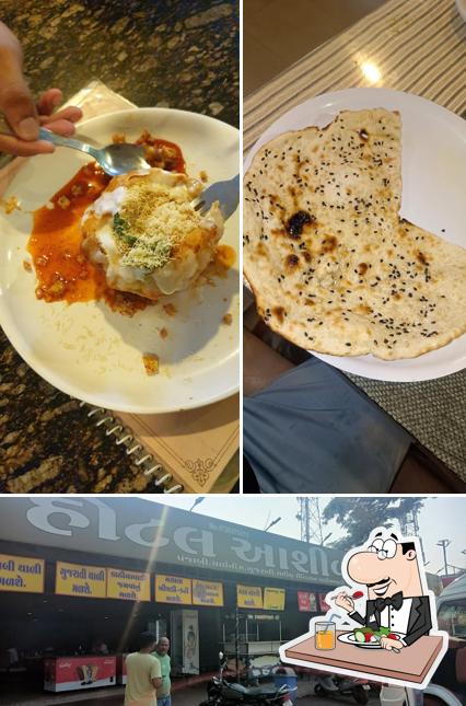 The photo of Hotel Ashirwad’s food and exterior