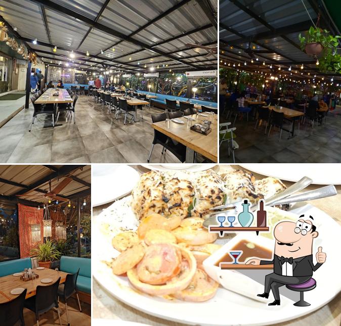 Take a seat at one of the tables at Hariyali Restaurant