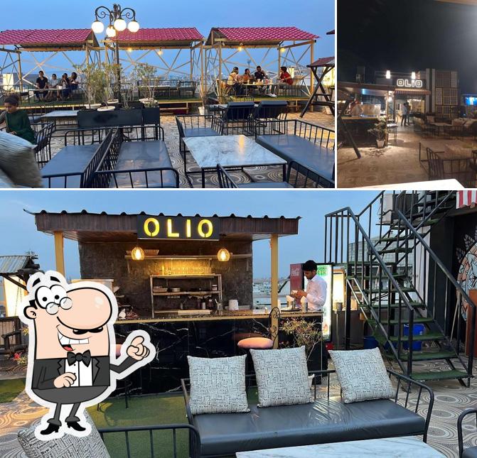 Take a seat at one of the tables at Olio Rooftop Restaurant & Kitchen : Best Rooftop Restaurant / Best Restaurant / Family Restaurant / Cafe in Jaipur