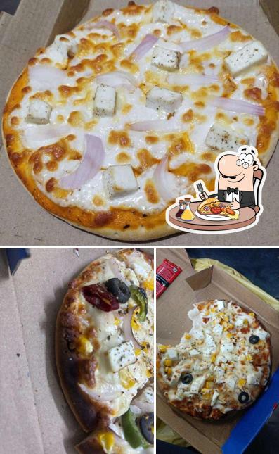 Try out pizza at Let's Eat Restro