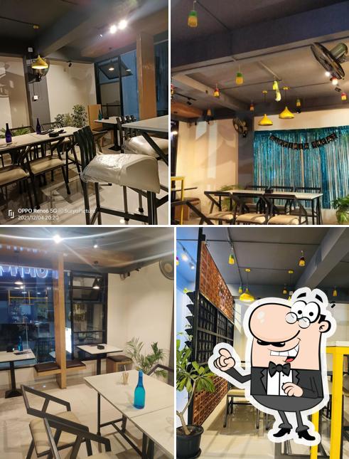 Take a seat at one of the tables at Yummy Tummy Cakes & Cafe (MB)