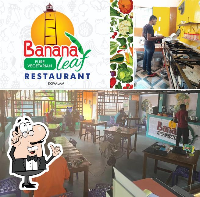 Take a seat at one of the tables at BANANA LEAF Kovalam Pure Vegetarian Restaurant