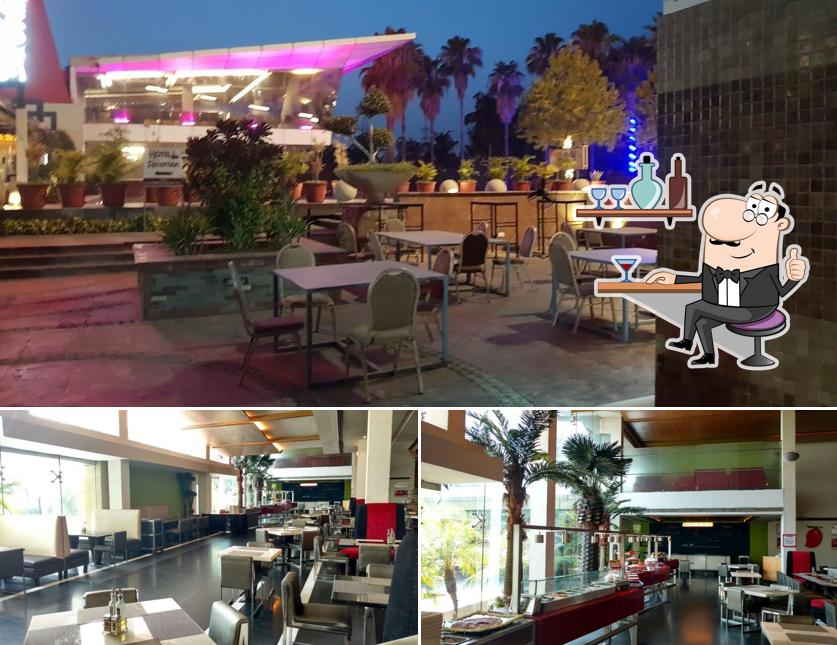 Take a seat at one of the tables at Hotel Red Mango