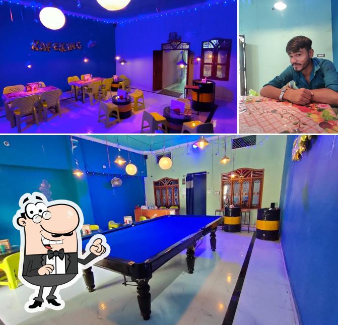 Take a seat at one of the tables at Kafe king