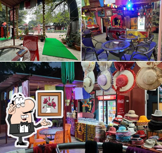 Take a seat at one of the tables at 25 Hours Hangout Cafe