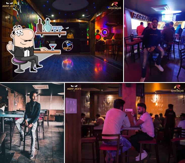 Take a seat at one of the tables at Agent Jacks Bar Miraj