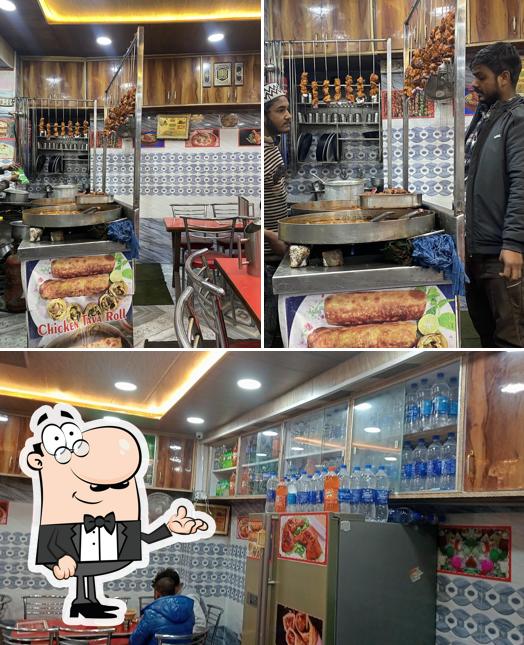 Take a seat at one of the tables at HALAL JM TAJ MUGHLAI