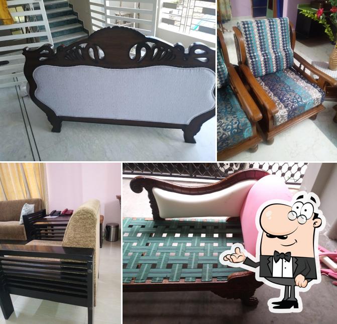 Take a seat at one of the tables at Sagar Hotel