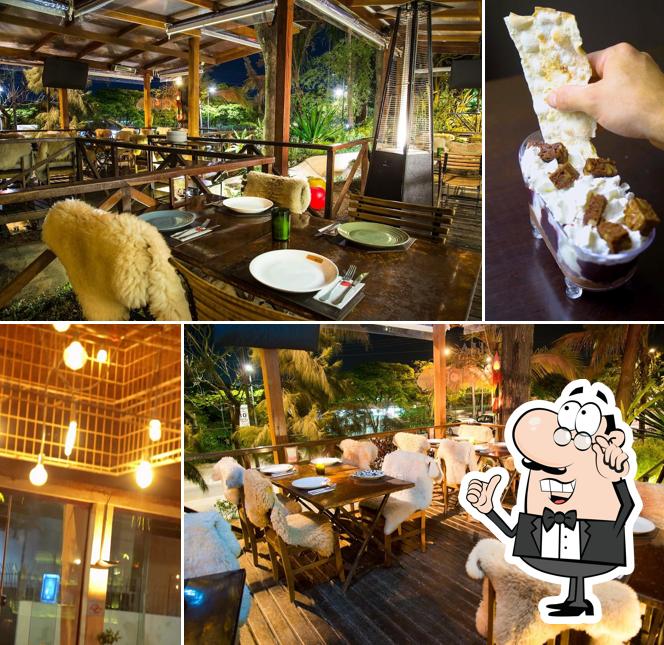 Sente em uma das mesas no Villa Soggiorno Pizzaria