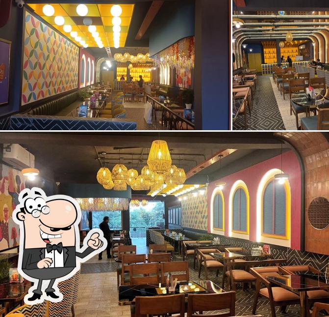 Take a seat at one of the tables at Son Of Swaad Orai - Pure Veg Restaurant/Family Restaurant in Orai
