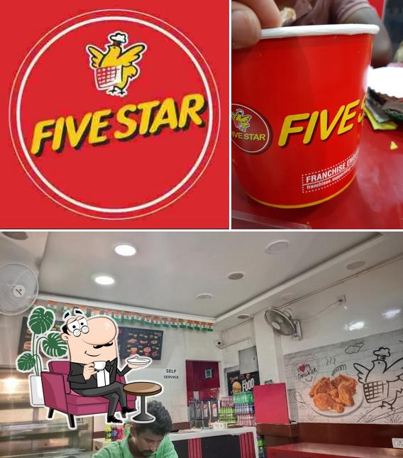 Take a seat at one of the tables at Five Star Chicken