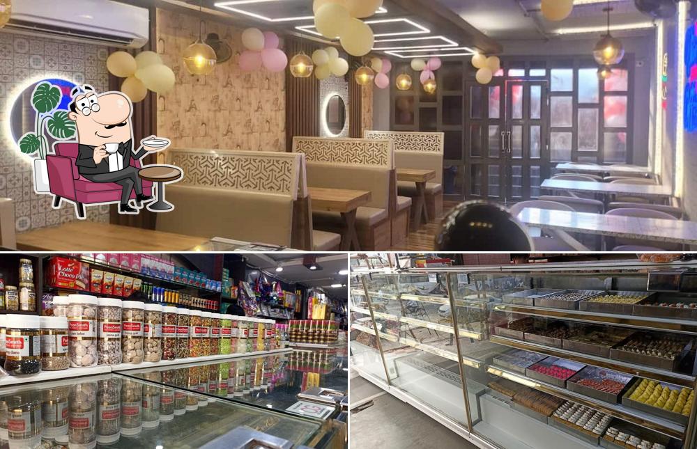 Take a seat at one of the tables at Chawla Sweets And Bakers