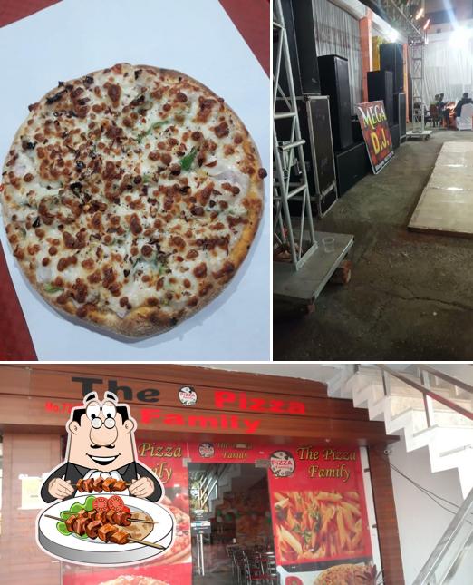 Take a look at the picture depicting food and interior at The pizza famil