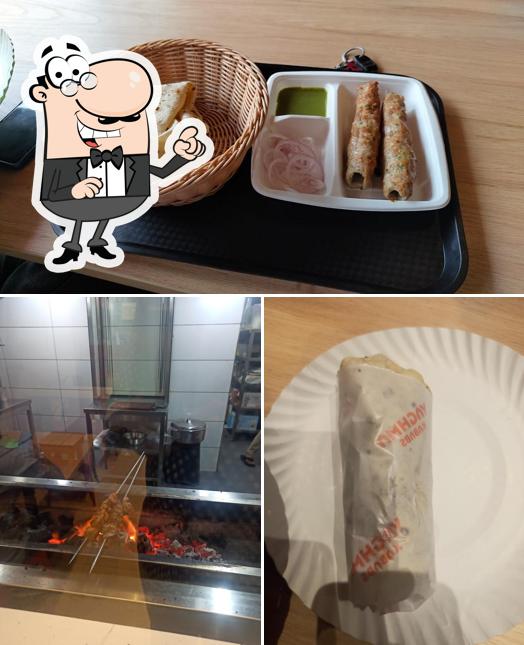 Take a look at the picture displaying interior and food at Yaghma Kababs