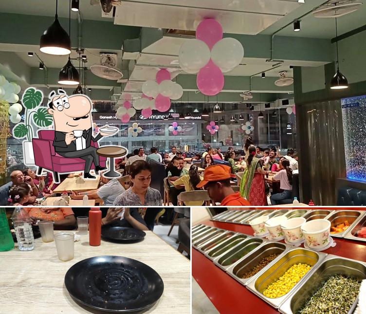 Check out the picture showing interior and food at Octant Pizza Gotri