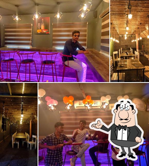 Take a seat at one of the tables at Food Factory Shantinagar