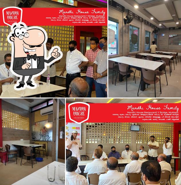 Take a seat at one of the tables at Mandhi House Family Restaurant