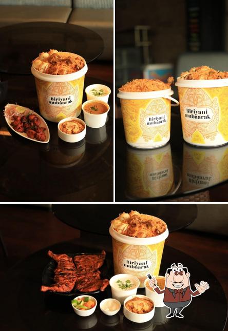 Take a look at the picture displaying food and interior at Biriyani Mubaarak