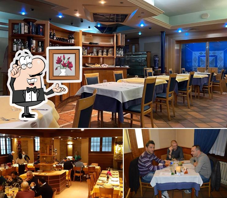 Guarda la foto che mostra la interni e tavolo da pranzo di Ristorante Crugnolino
