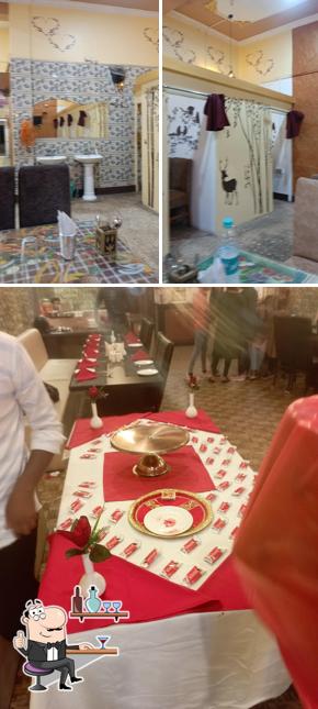 Take a seat at one of the tables at Pink Kitchen Restaurant
