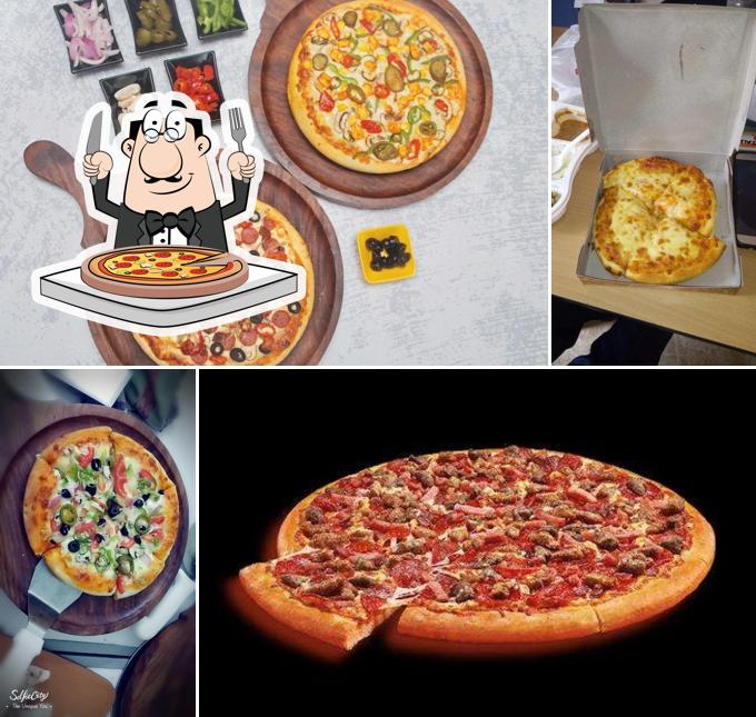 Try out pizza at HOUSE OF PIZZAS
