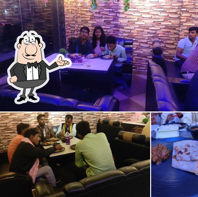 This is the image depicting interior and food at Food Mahal Couple's Cafe & Restaurant