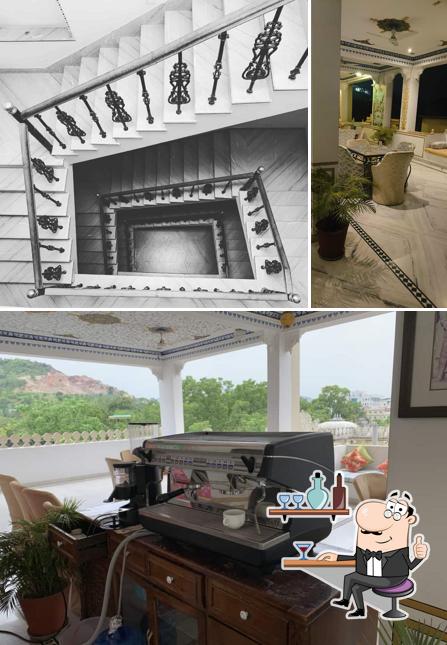 Take a seat at one of the tables at Medi Pe Cafe & Restaurant - Rooftop Cafe & Restaurant in Udaipur