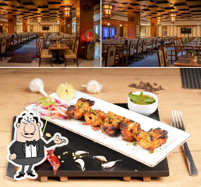 Check out the picture depicting interior and food at Virunthu