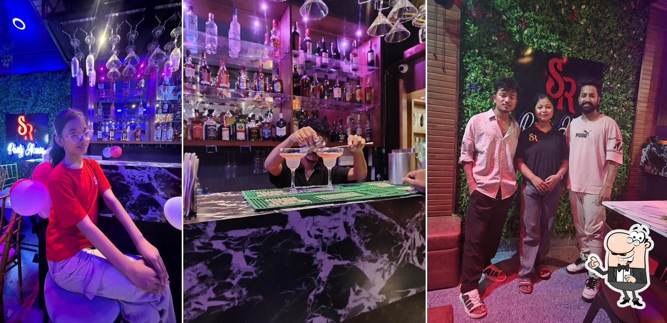 Take a seat at one of the tables at SR bar & restaurant , Best Restaurant and Bar in Moranhat